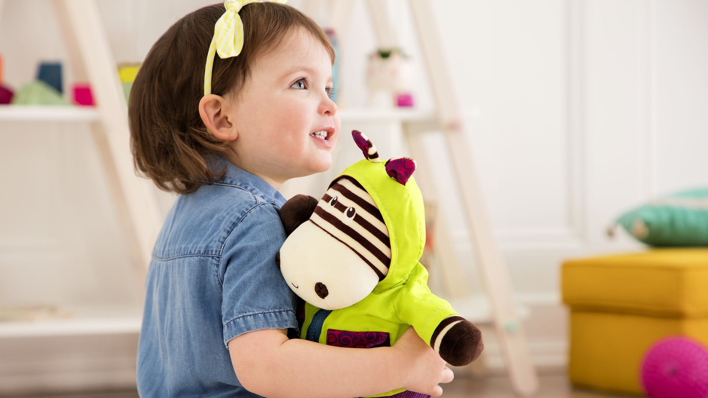 2 year Old girl with a Zebra Soft toy